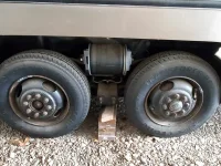 GMC Leftside Airbags with Firestone 10 Ply Transforce Tires.webp