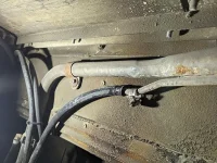 OEM vent line in driver's side wheel well.webp